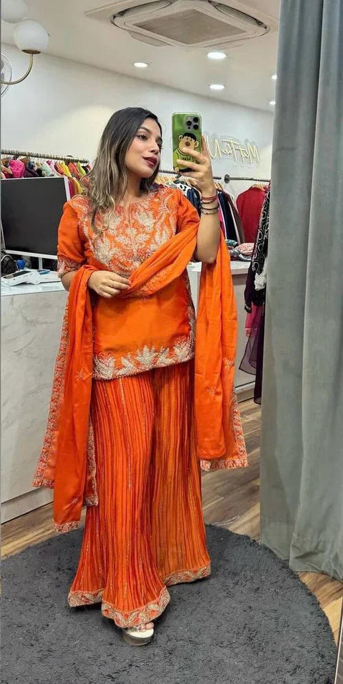 Luxurious outfit with golden accents and floral embroidery